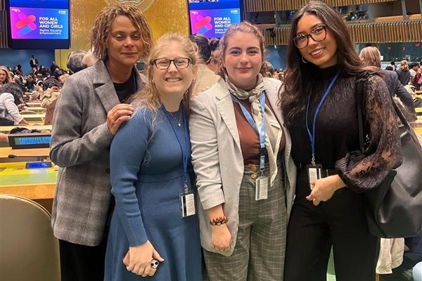 Four women at the Commission on the Status of Women meeting